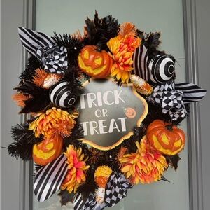 Festive Halloween Wreath with Pumpkins and Flowers